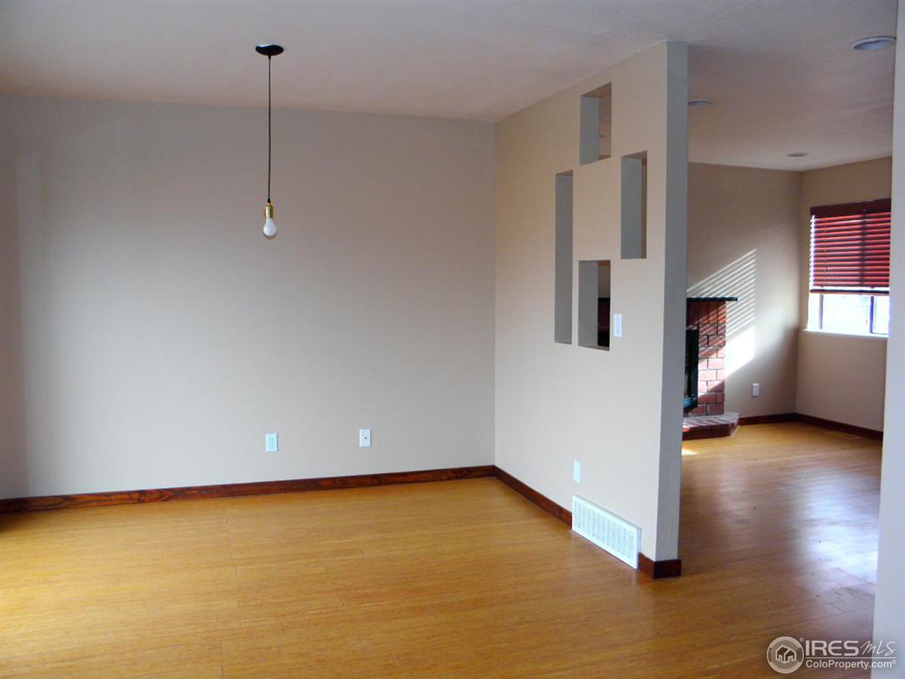 6628 Kalua Road Boulder, CO 80301 - Photo 5 of 13 a view of empty room with wooden floor and window