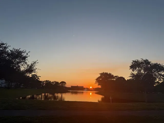 a view of lake with green space