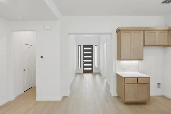 a view of a storage & utility room with a sink