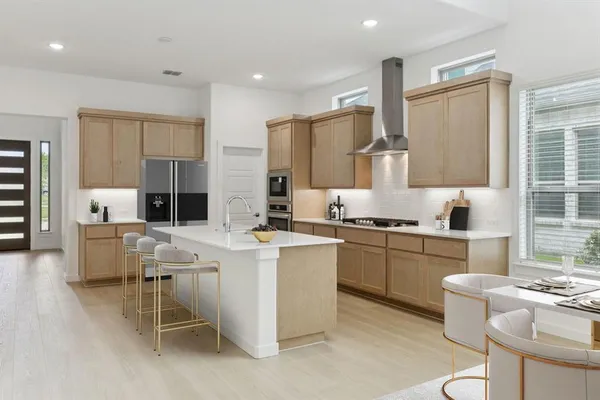 a kitchen with appliances a sink cabinets and a counter top space