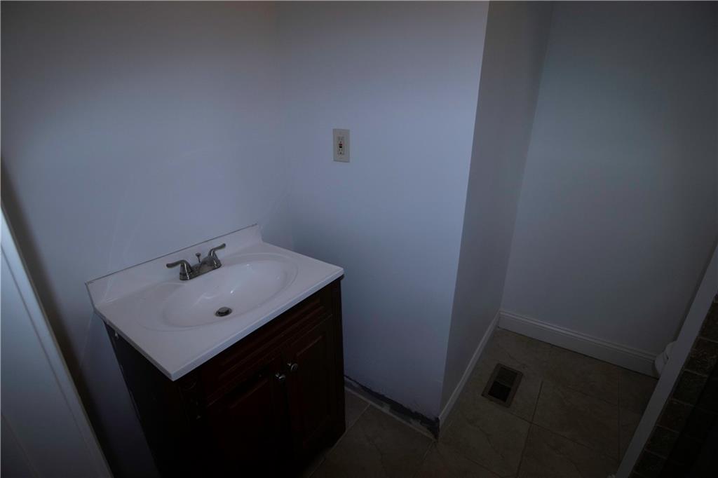 1292 Monfort Road Lawrenceville, GA 30046 - Photo 30 of 48 a bathroom with a sink and mirror