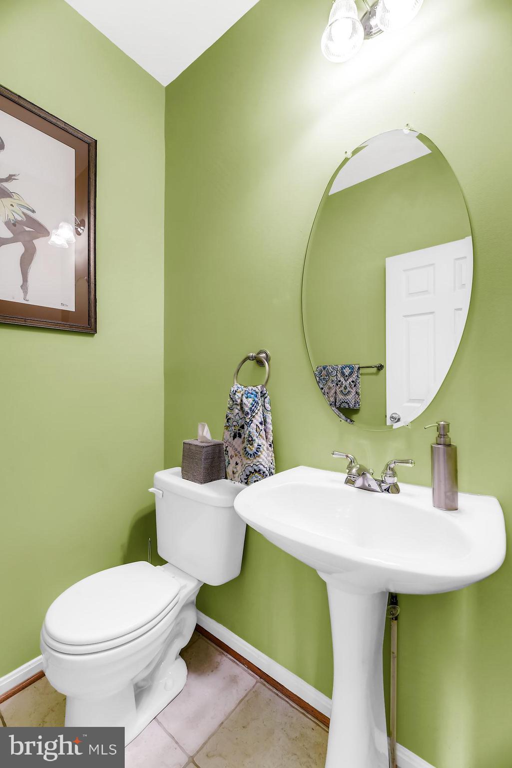 2090 Clipper Park Road Baltimore, MD 21211 - Photo 10 of 75 a bathroom with a sink and mirror