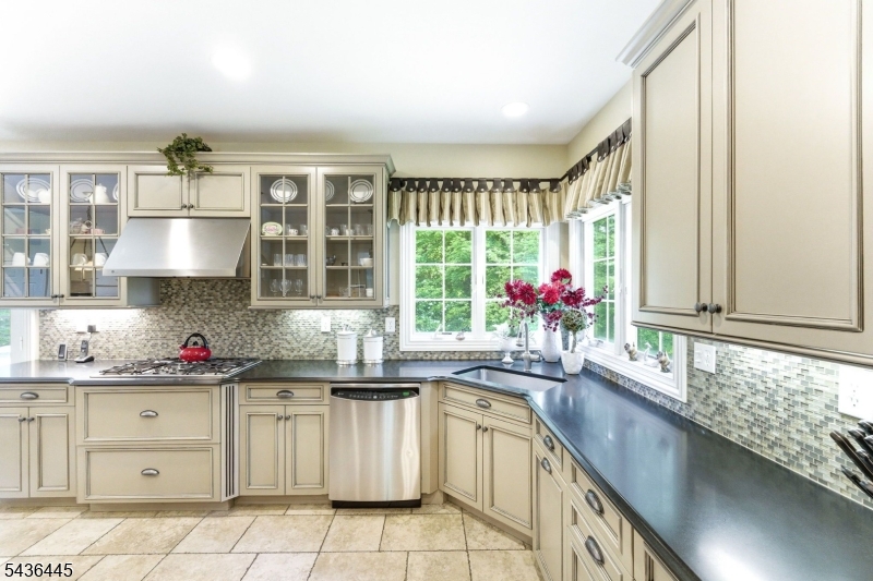 4 Windemere Way Sparta, NJ 07871 - Photo 15 of 50 a kitchen with granite countertop a sink window and cabinets