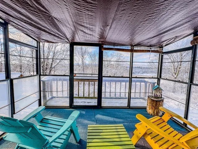 a living room with large windows