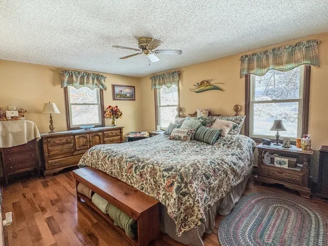 a bed room with a bed and a dresser