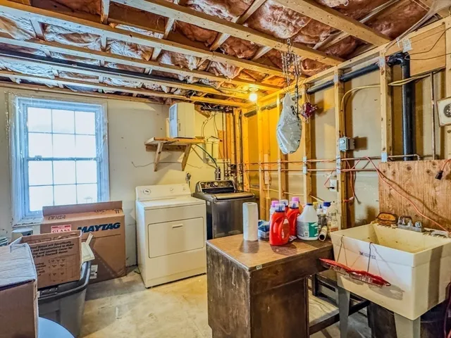 a storage room with a stove and a table