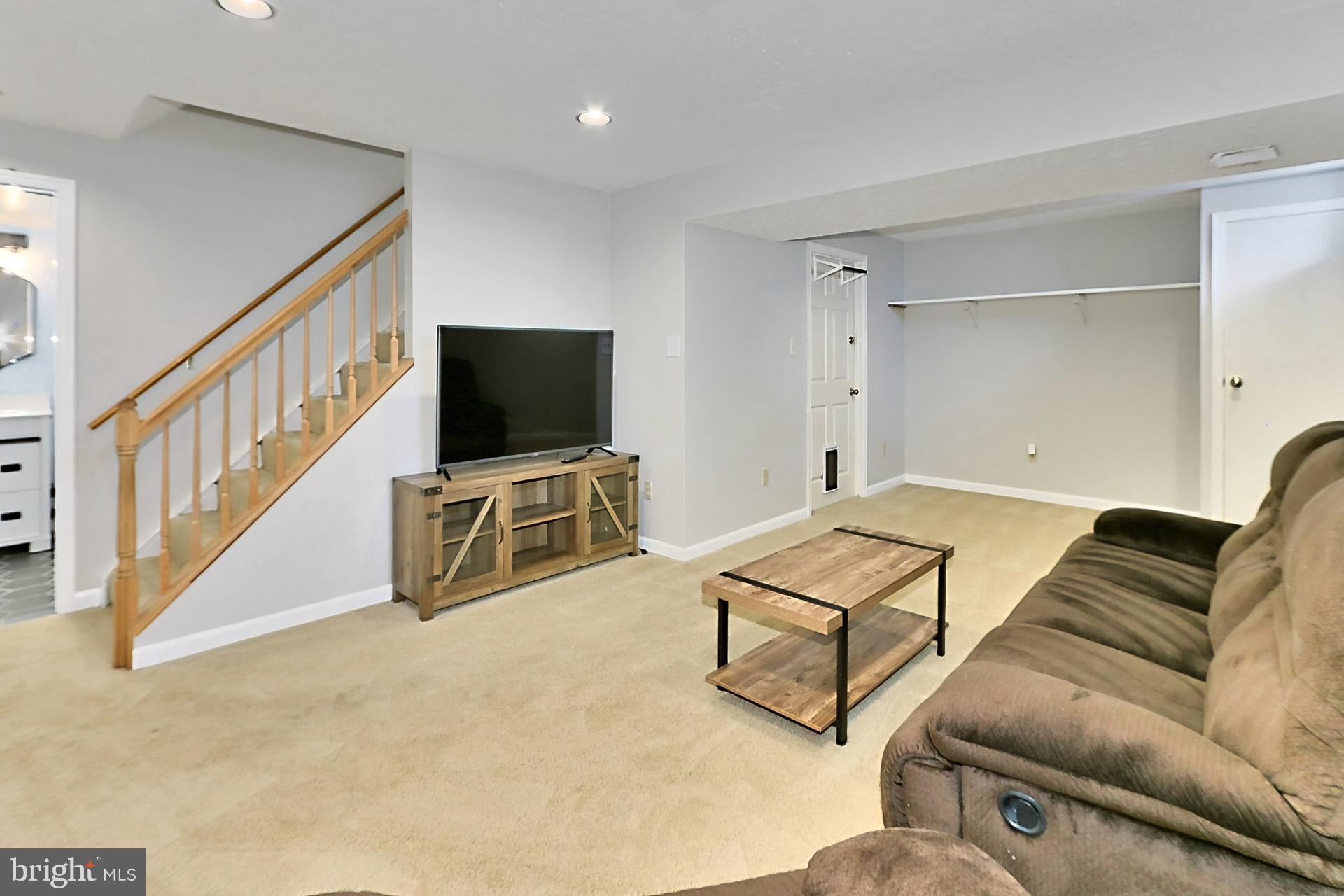 8285 Deep Valley Court Springfield, VA 22153 - Photo 28 of 39 Recreation room with neutral carpeting