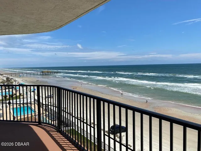 a balcony with wooden floor