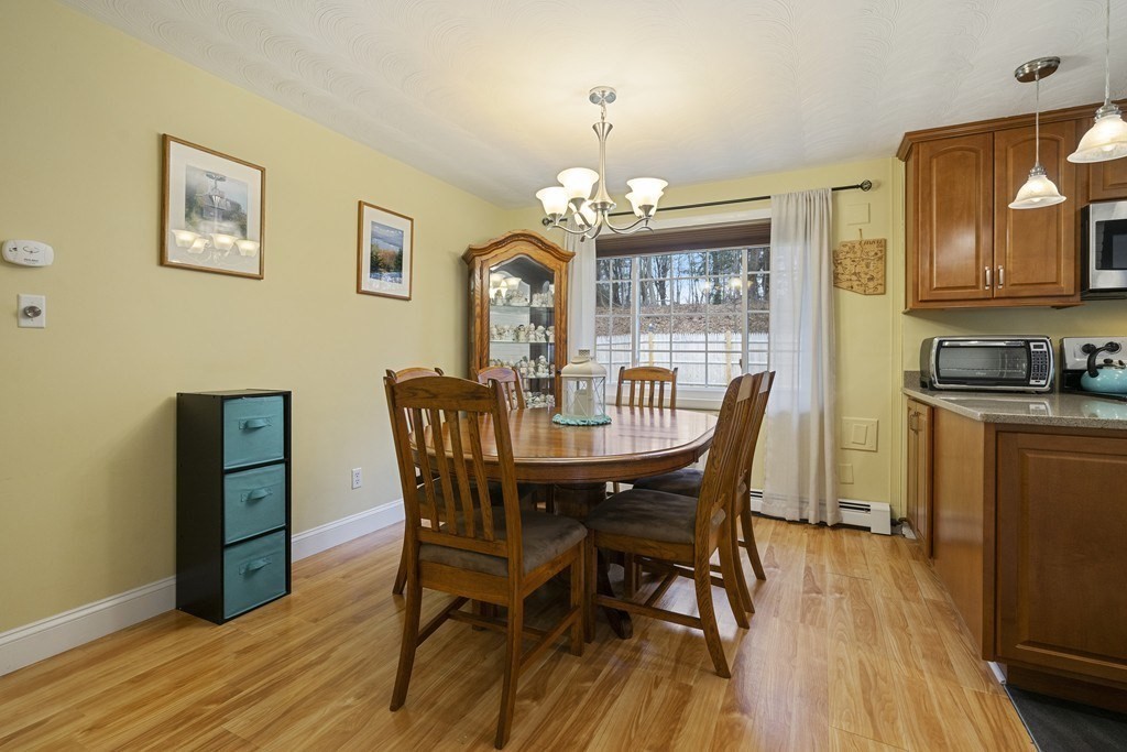 26 Edith Road Framingham, MA 01701 - Photo 13 of 42 a view of a dining room with furniture and wooden floor