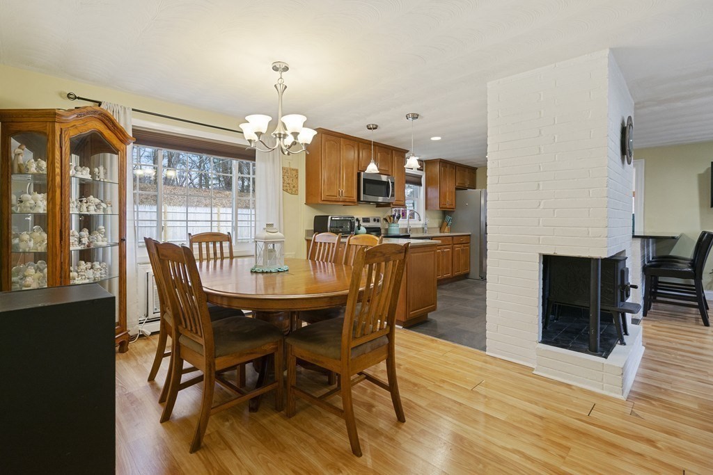 26 Edith Road Framingham, MA 01701 - Photo 14 of 42 a view of a dining room with furniture window and wooden floor