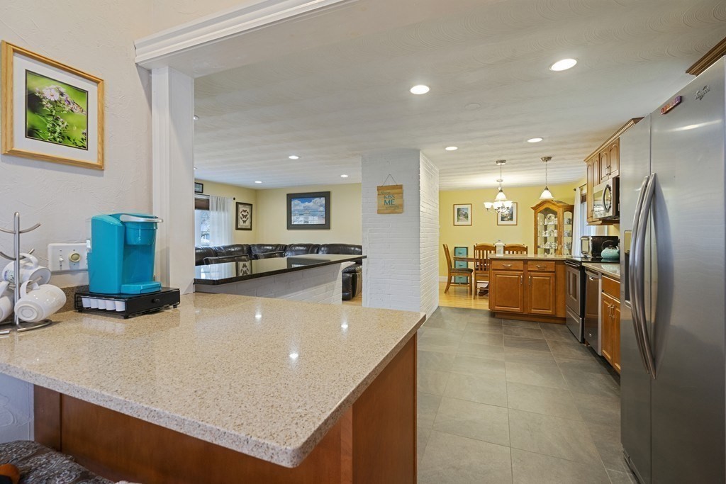 26 Edith Road Framingham, MA 01701 - Photo 20 of 42 a large kitchen with a large counter top appliances and cabinets