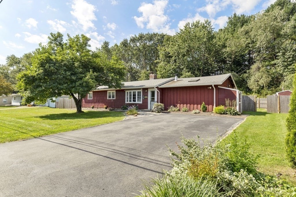 26 Edith Road Framingham, MA 01701 - Photo 2 of 42 a front view of a house with a yard and garage