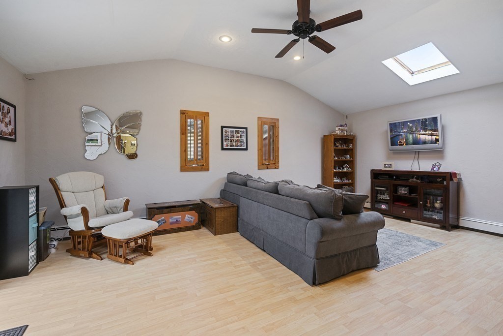26 Edith Road Framingham, MA 01701 - Photo 21 of 42 a living room with furniture and a flat screen tv