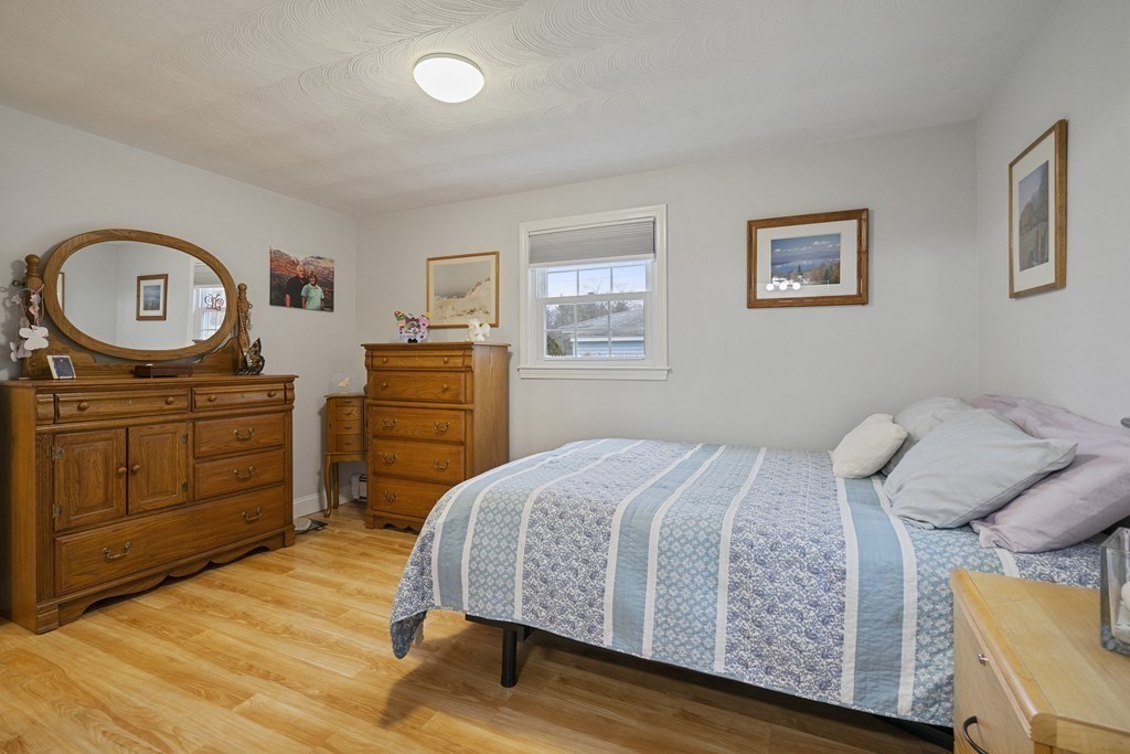 26 Edith Road Framingham, MA 01701 - Photo 24 of 42 a bedroom with a bed and a dresser