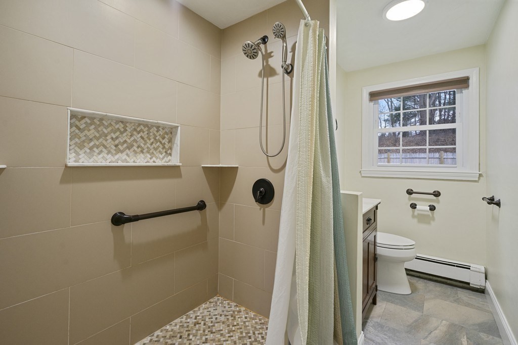 26 Edith Road Framingham, MA 01701 - Photo 29 of 42 a bathroom with a shower a toilet and a window
