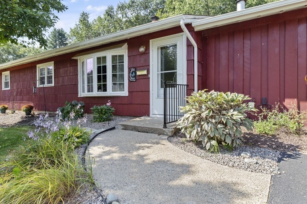 26 Edith Road Framingham, MA 01701 - Photo 3 of 42 a front view of a house with garden