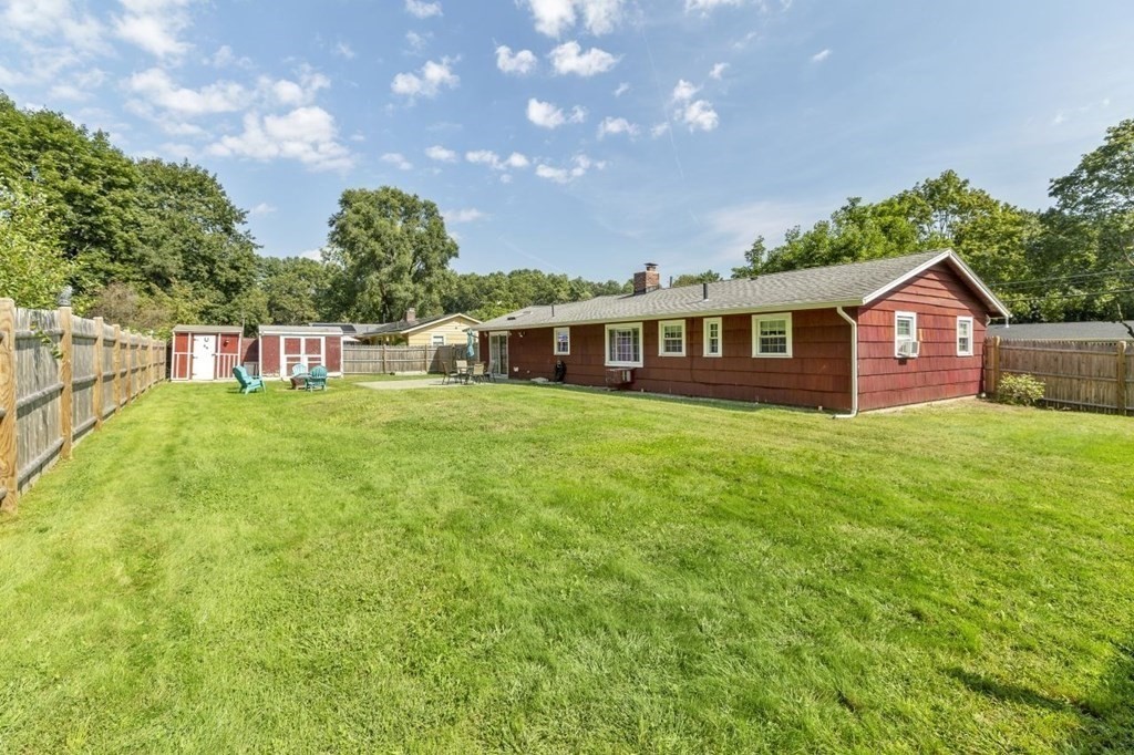 26 Edith Road Framingham, MA 01701 - Photo 33 of 42 a view of a house with a big yard and large trees