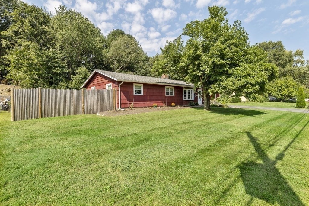 26 Edith Road Framingham, MA 01701 - Photo 4 of 42 a view of a house with a yard and sitting area