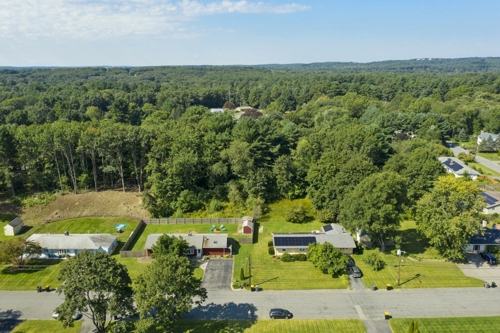 26 Edith Road Framingham, MA 01701 - Photo 42 of 42 an aerial view of a house with a yard