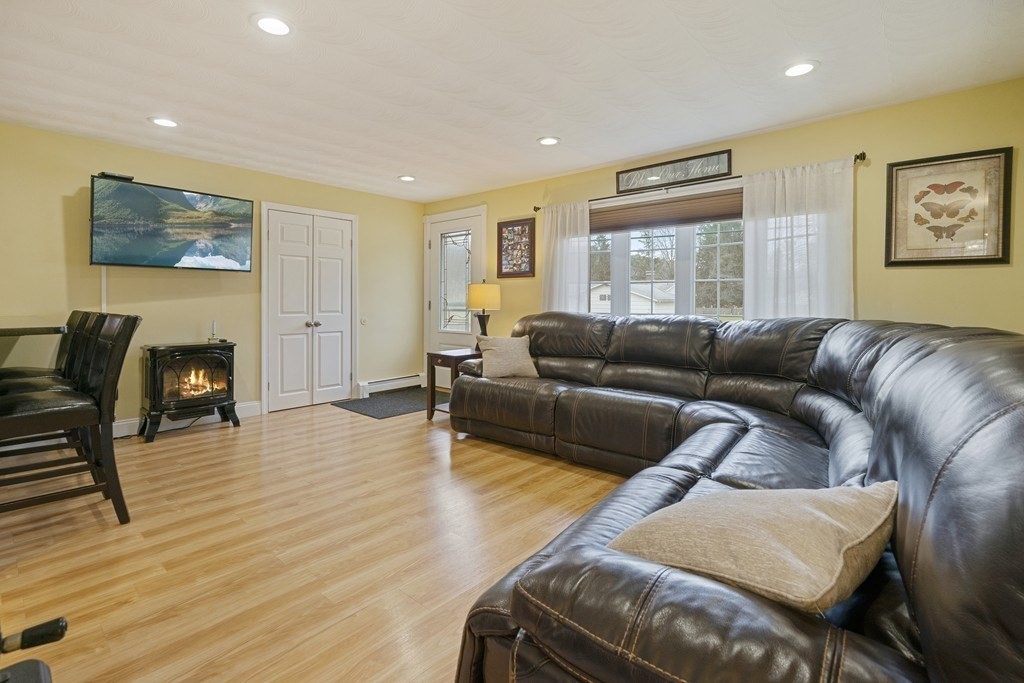26 Edith Road Framingham, MA 01701 - Photo 8 of 42 a living room with furniture and a fireplace
