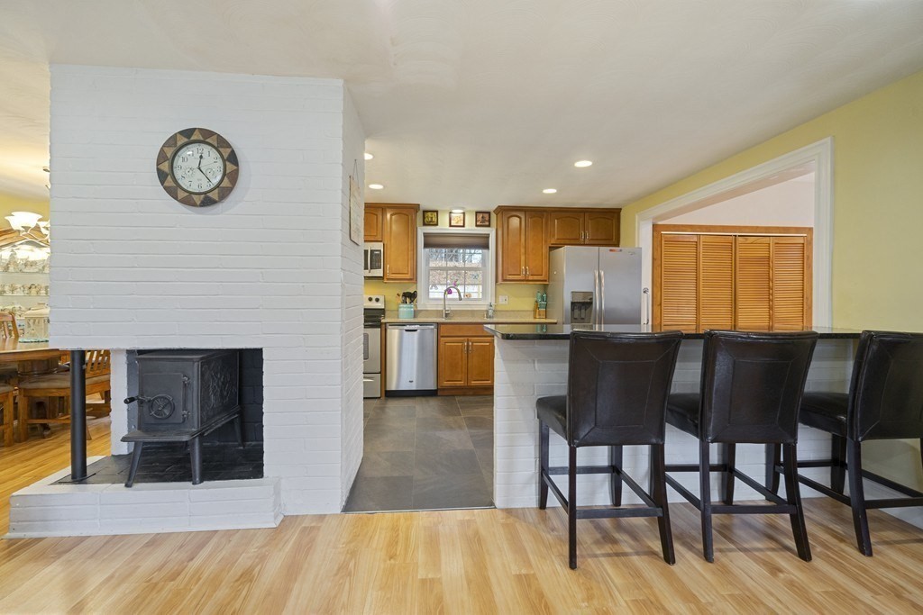 26 Edith Road Framingham, MA 01701 - Photo 9 of 42 a view of kitchen with cabinets and wooden floor