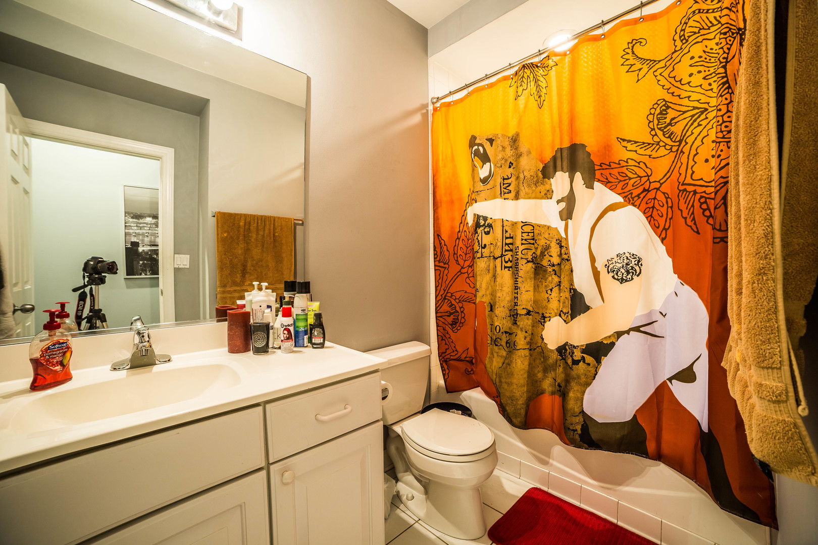 2629 North Ashland Avenue, Unit 2A Chicago, IL 60614 - Photo 14 of 19 a bathroom with a toilet sink and mirror