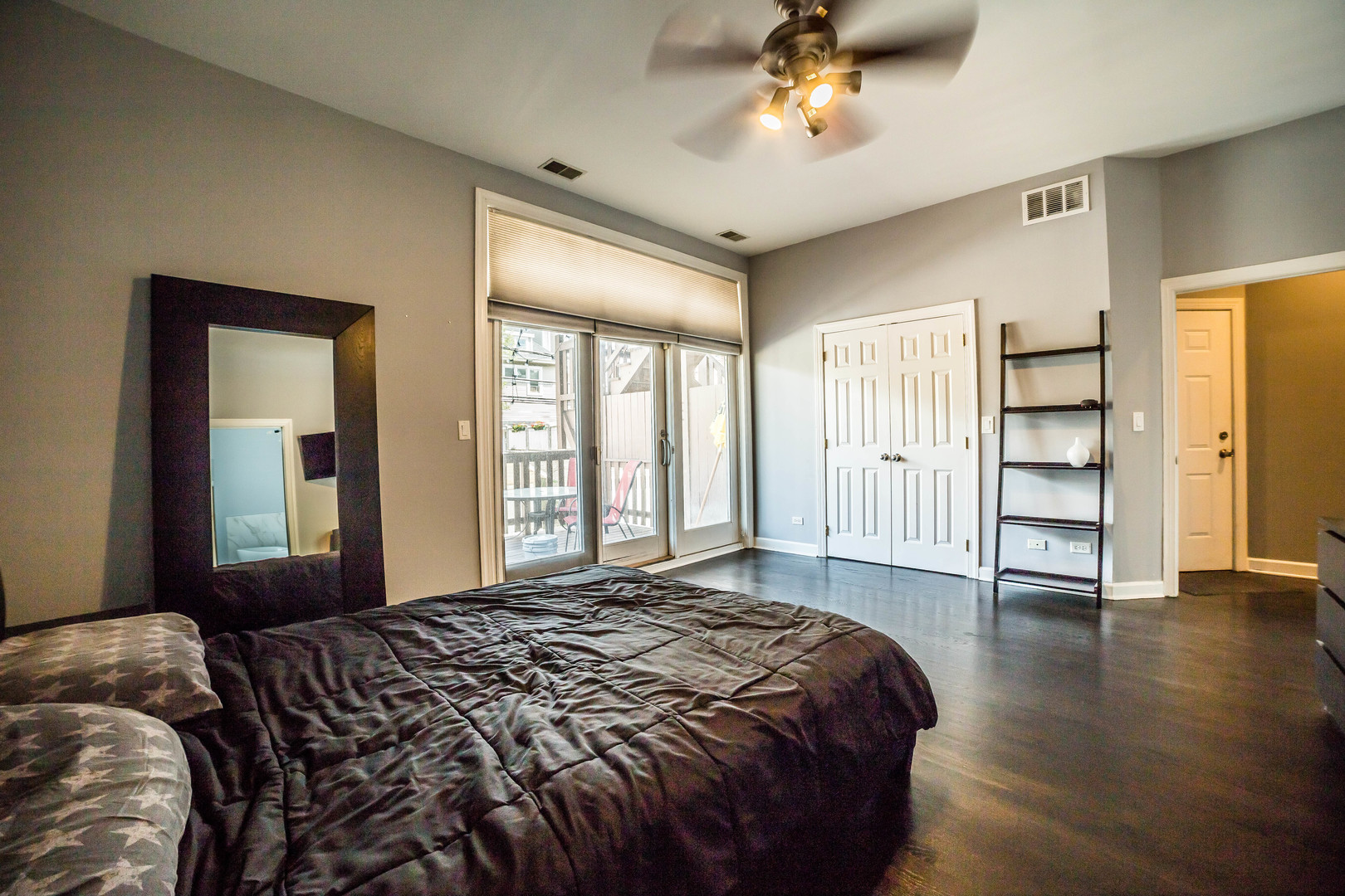 2629 North Ashland Avenue, Unit 2A Chicago, IL 60614 - Photo 16 of 19 a bedroom with a bed and a large window