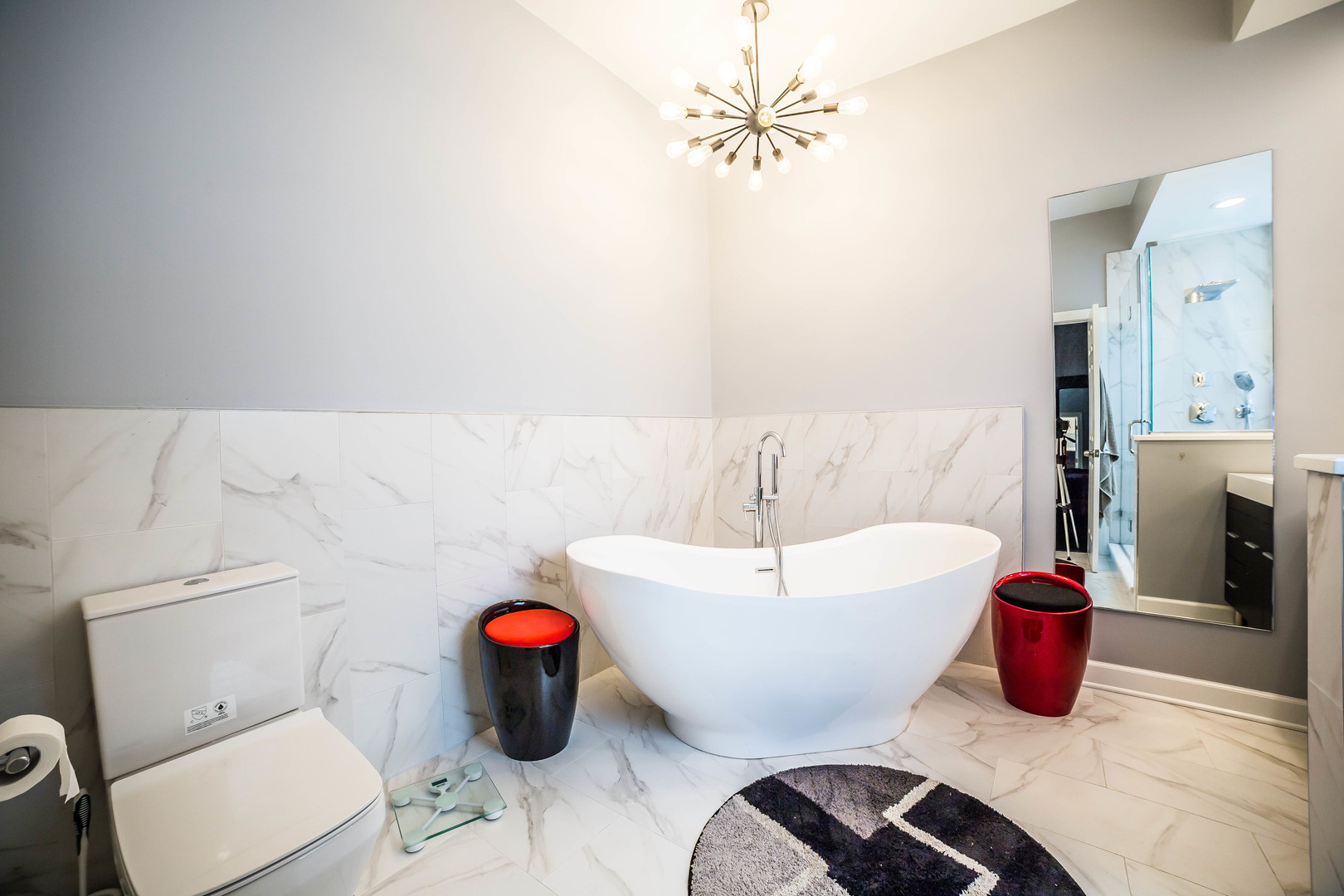 2629 North Ashland Avenue, Unit 2A Chicago, IL 60614 - Photo 17 of 19 a bathroom with a bathtub sink mirror and toilet