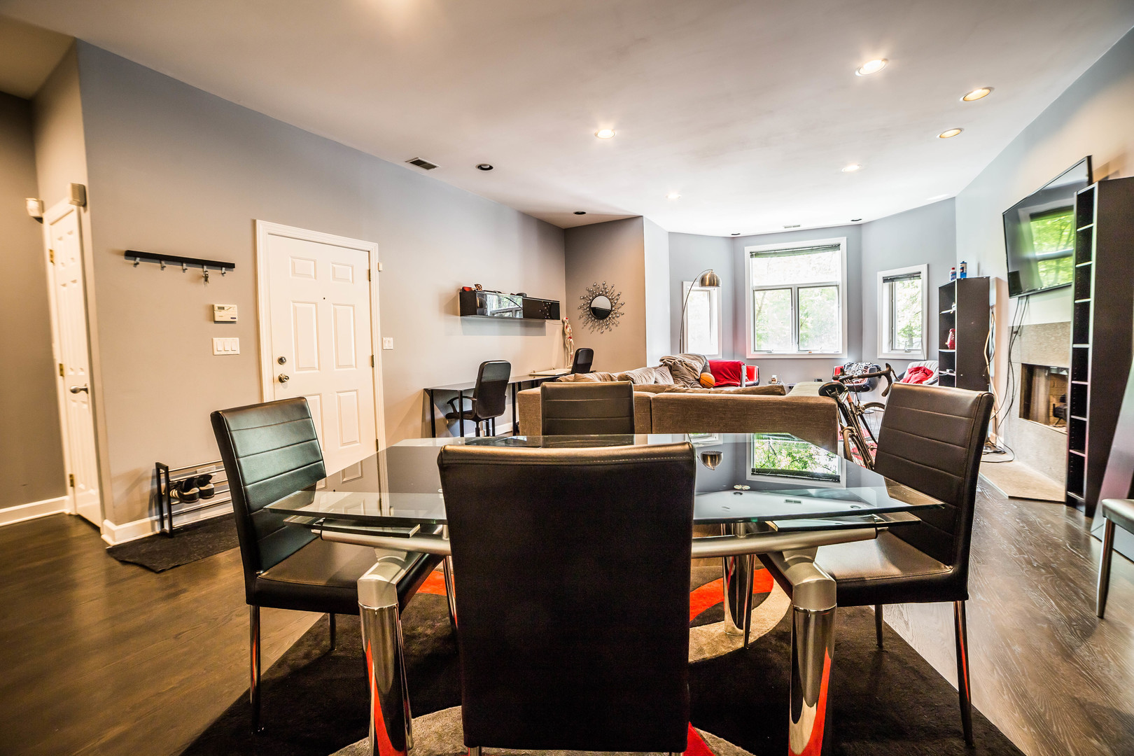 2629 North Ashland Avenue, Unit 2A Chicago, IL 60614 - Photo 6 of 19 a living room with furniture a flat screen tv and floor to ceiling window