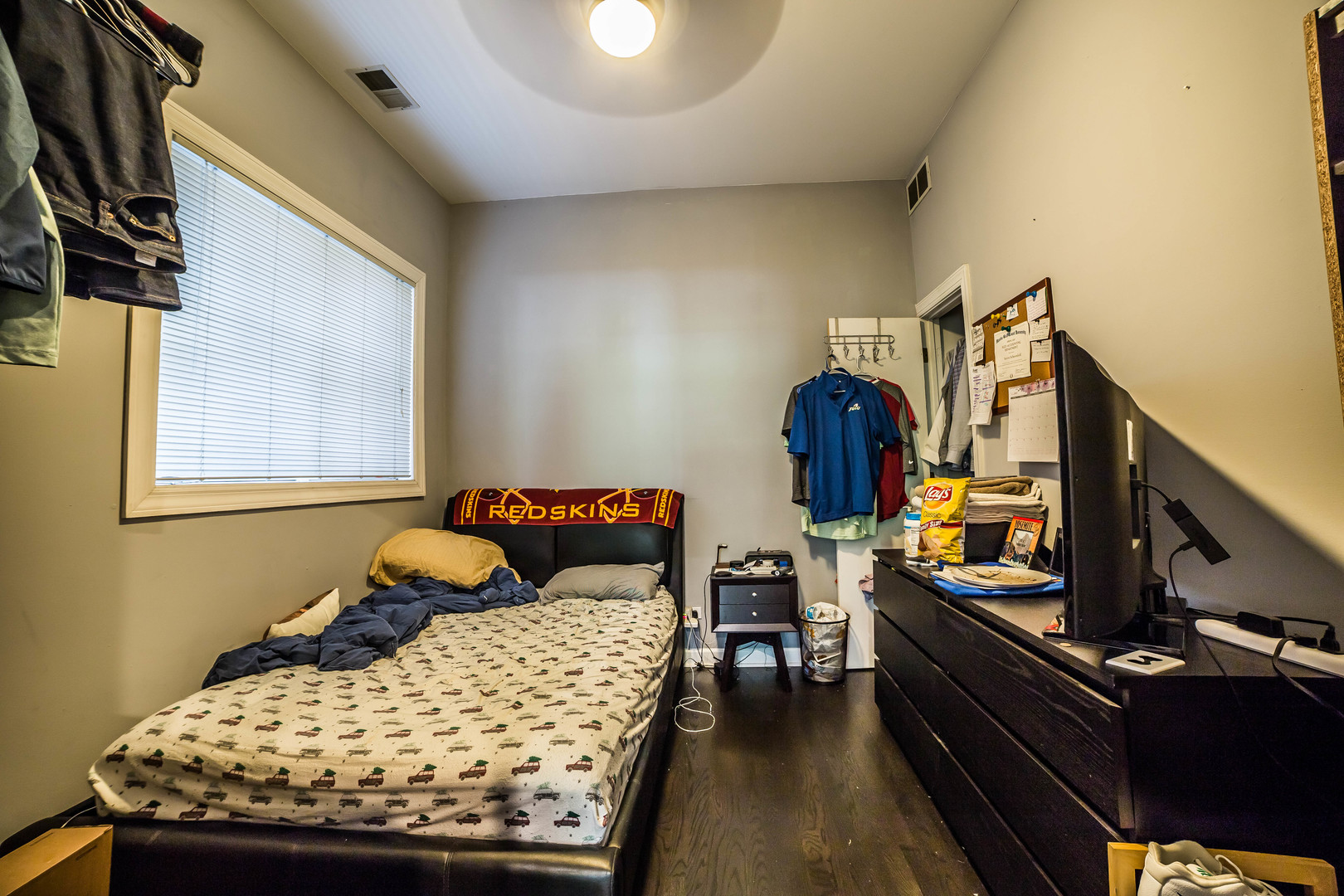2629 North Ashland Avenue, Unit 2A Chicago, IL 60614 - Photo 7 of 19 a bedroom with a bed and wooden floor