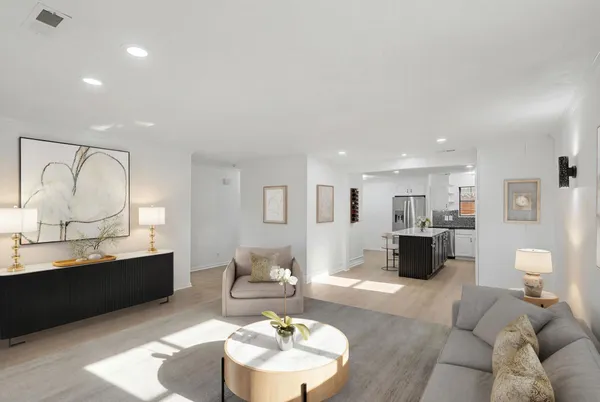 a living room with furniture and a lamp