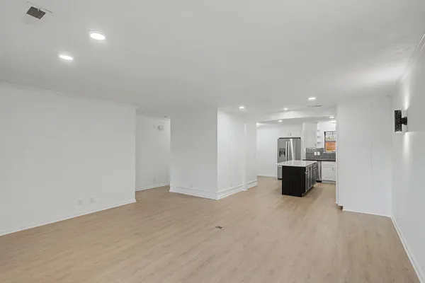 a view of kitchen with stainless steel appliances refrigerator and microwave