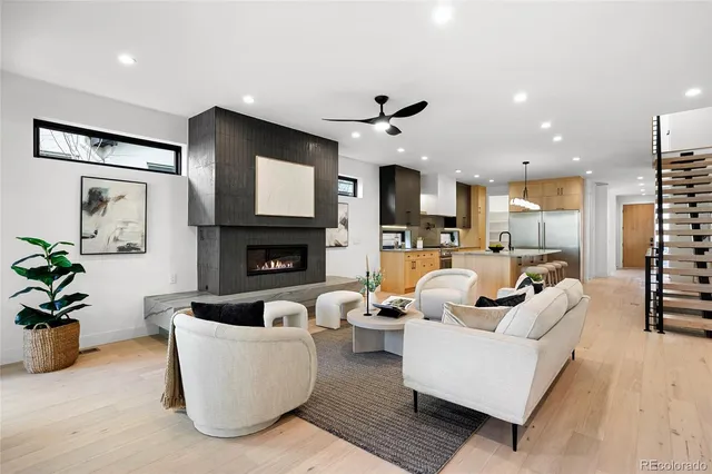 a living room with fireplace furniture and a flat screen tv