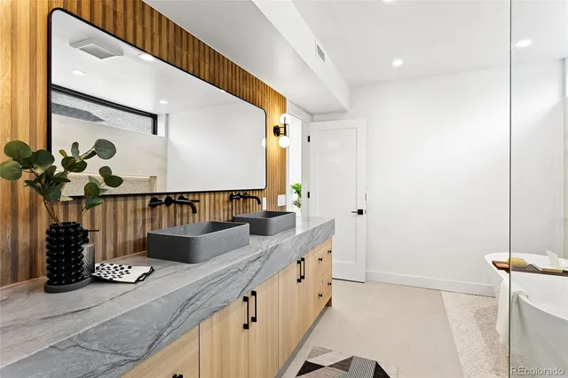 a bathroom with mirror and