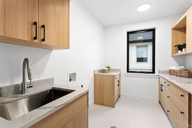 a kitchen with a sink and cabinets