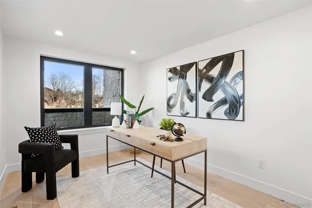 a view of balcony with wooden floor