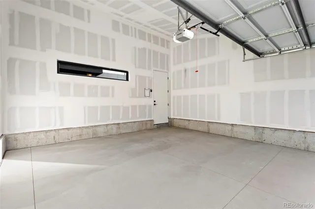 a black and white photo of a white wall