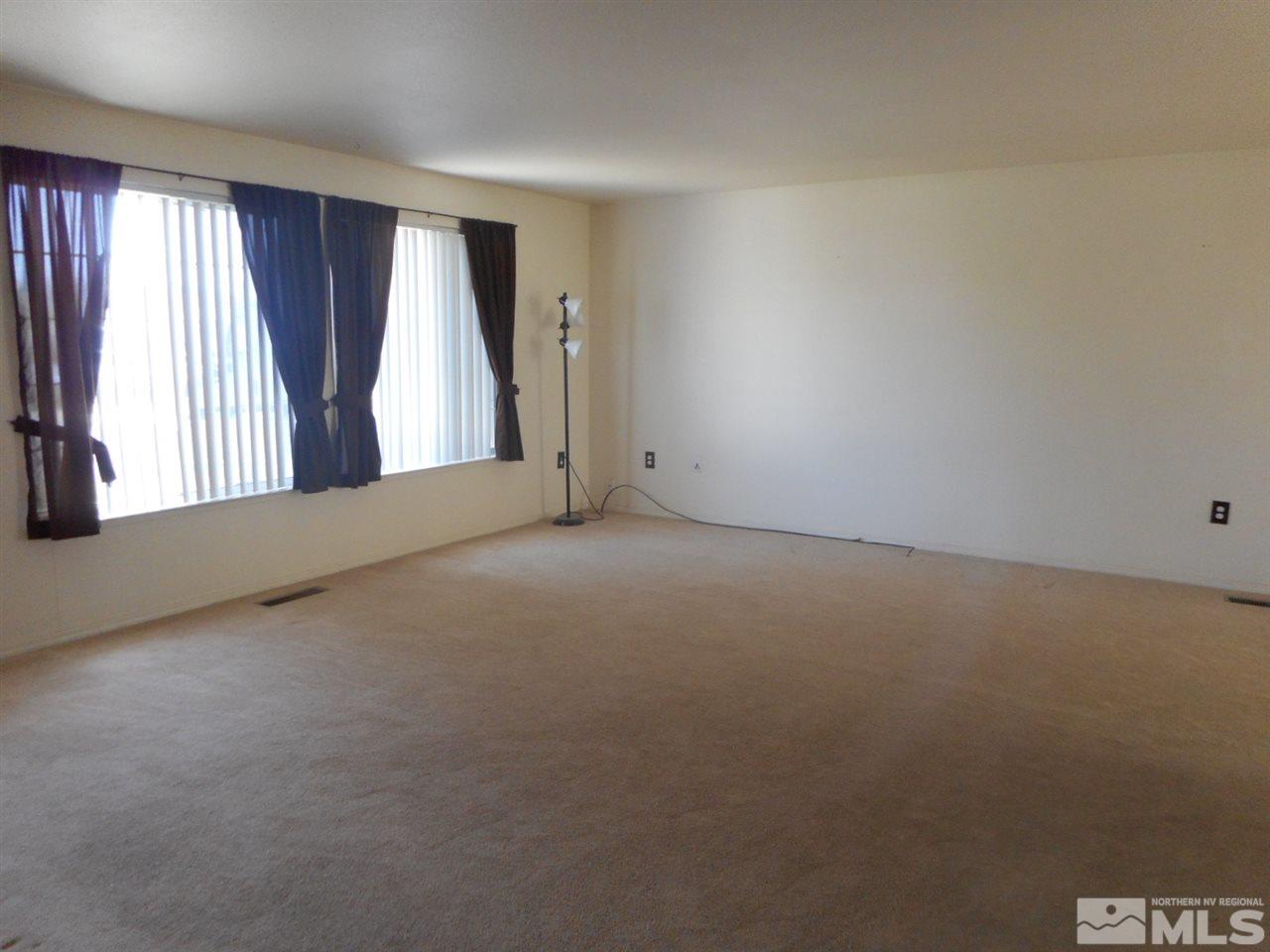 555 Yellow Jacket Road Dayton, NV 89403 - Photo 3 of 17 an empty room with windows