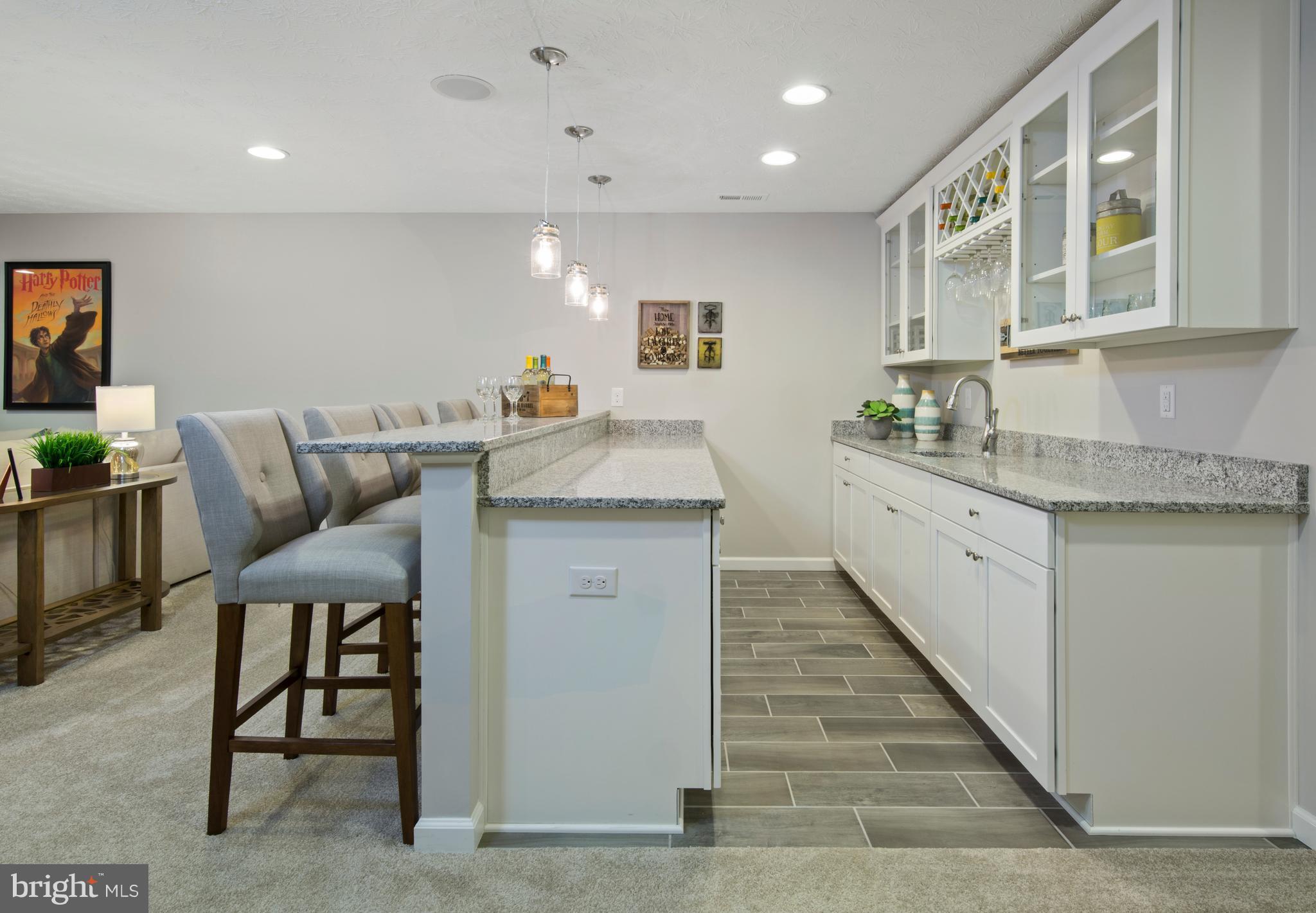 3118 Roderick Road Frederick, MD 21704 - Photo 22 of 25 a living room with stainless steel appliances kitchen island granite countertop furniture and a kitchen view