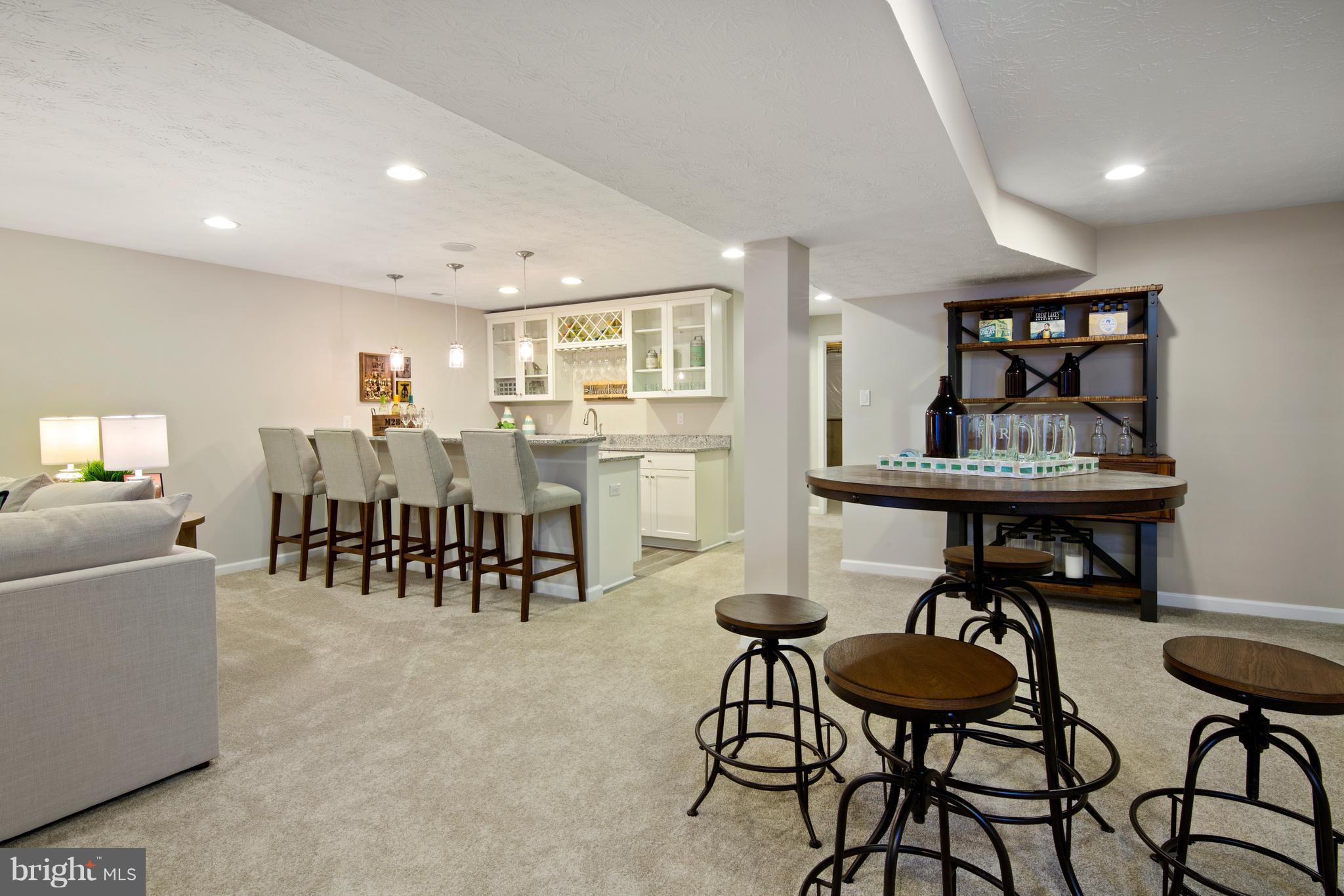 3118 Roderick Road Frederick, MD 21704 - Photo 23 of 25 a view of a dining room with furniture and a potted plant