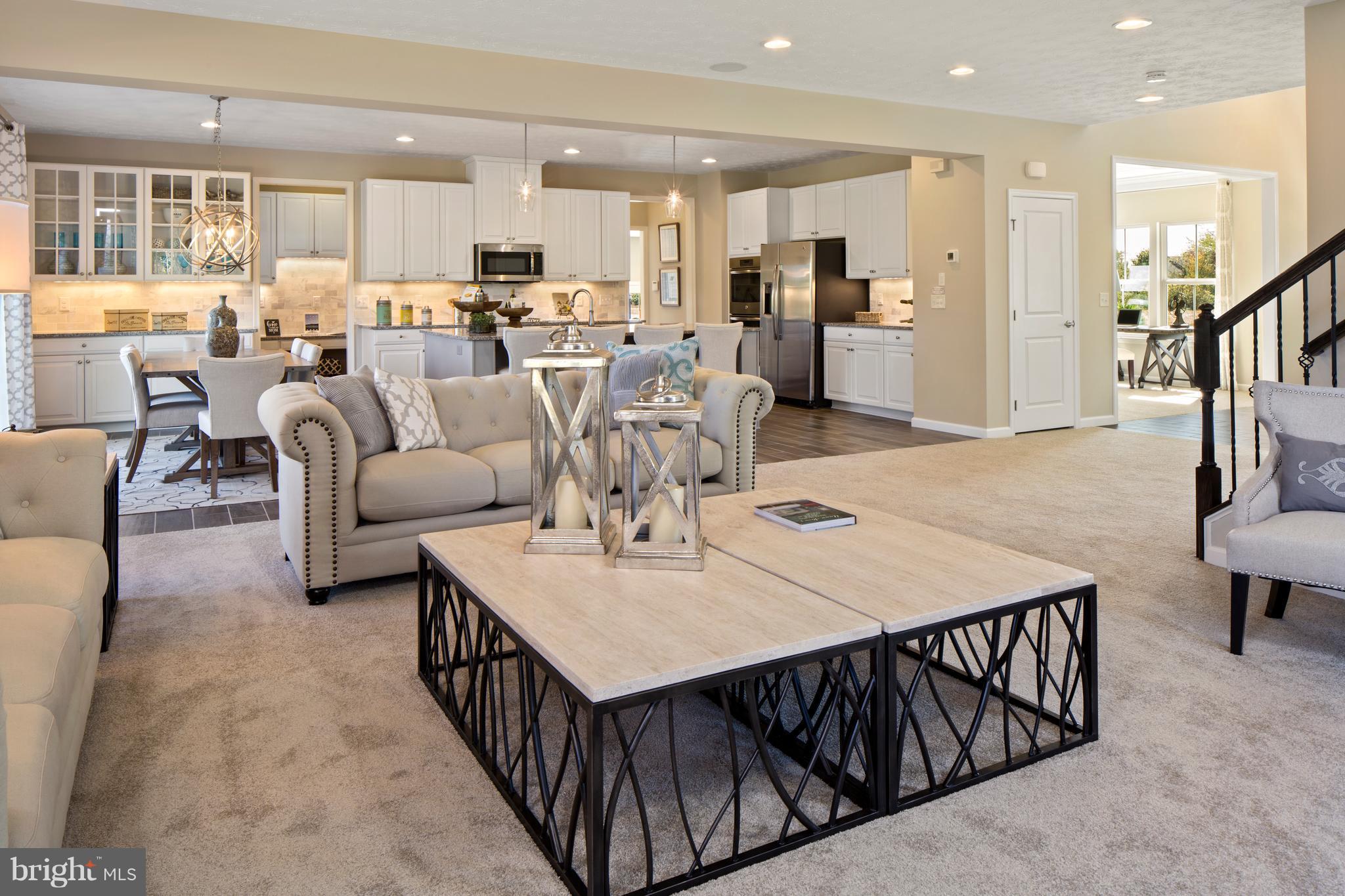 3118 Roderick Road Frederick, MD 21704 - Photo 4 of 25 a living room with stainless steel appliances kitchen island granite countertop a table chairs and a view of living room