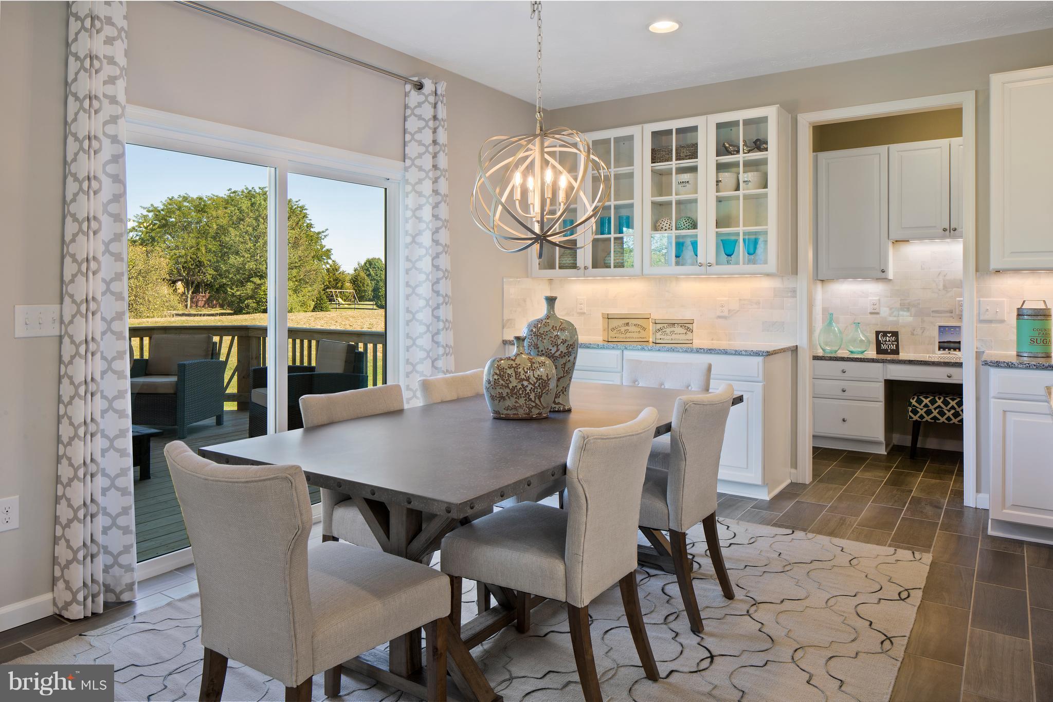 3118 Roderick Road Frederick, MD 21704 - Photo 6 of 25 a view of a dining room with furniture and chandelier