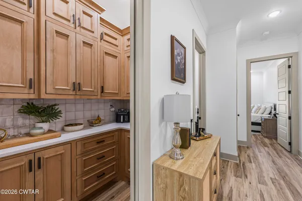 a kitchen with stainless steel appliances granite countertop a sink a stove and cabinets