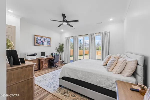 a bedroom with a bed and furniture