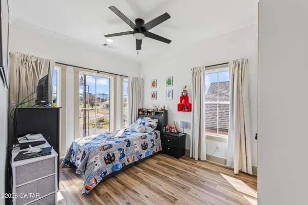 a bed room with a bed and a window