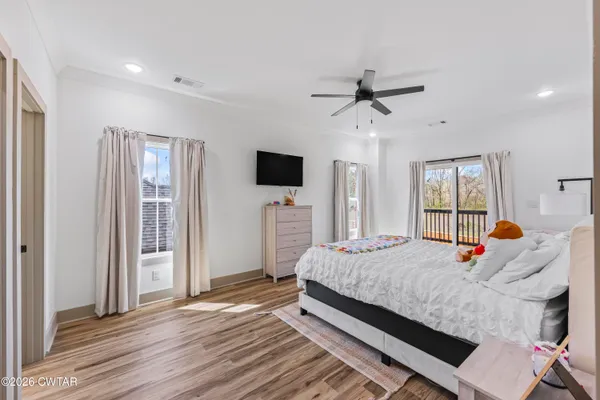 a bed room with a bed and a television