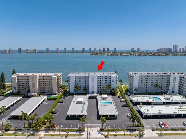 a front view of building with outdoor space and lake view
