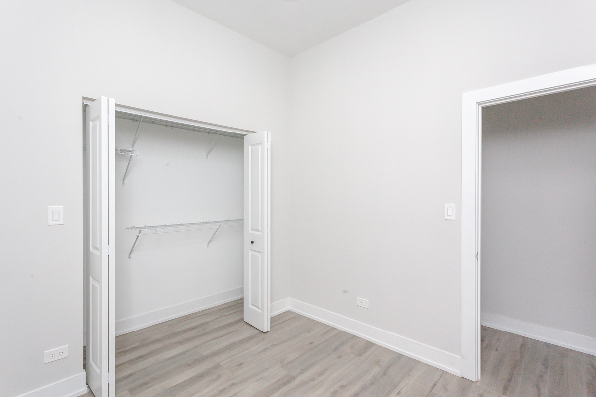 818 West 18th Street, Unit 4M Chicago, IL 60608 - Photo 7 of 10 a view of an empty room with wooden floor