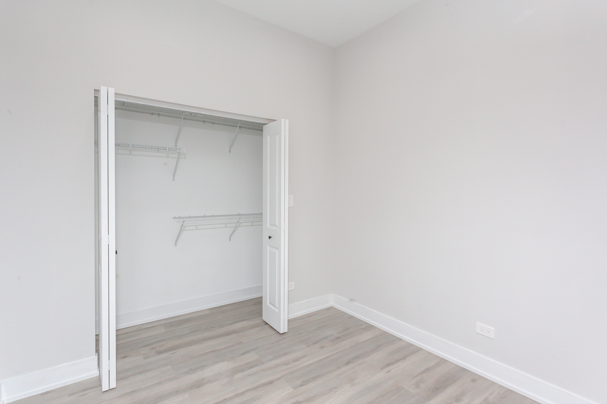 818 West 18th Street, Unit 4M Chicago, IL 60608 - Photo 9 of 10 a view of an empty room with wooden floor