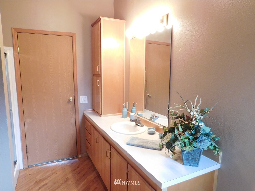 18022 Lawton Lane Southwest Rochester, WA 98579 - Photo 18 of 25 a bathroom with a double vanity sink and a mirror